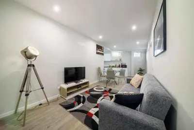a living room with a couch and a television at Pena Apartments - B by MTH in Funchal
