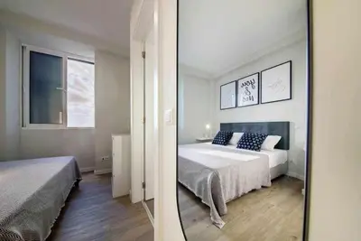 a bedroom with a bed and a mirror at Pena Apartments - B by MTH in Funchal