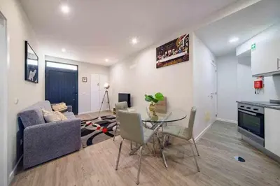 a living room with a table and a couch at Pena Apartments - B by MTH in Funchal