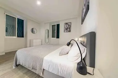 a bedroom with a bed with a lamp on a table at Pena Apartments - B by MTH in Funchal