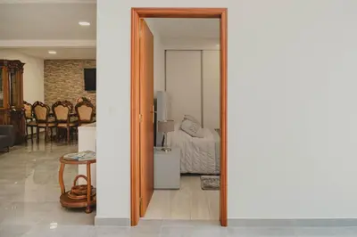 a mirror in a room with a living room at Casa Estrelicia in Ponta do Sol