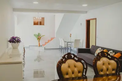 a living room with a couch and a table at Casa Estrelicia in Ponta do Sol