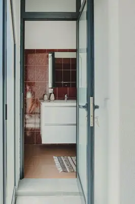 a bathroom with a tub and a sink and a mirror at Casa Estrelicia in Ponta do Sol