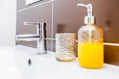 a bathroom with a sink and a mirror at Casa Da Avo Clementina in Funchal