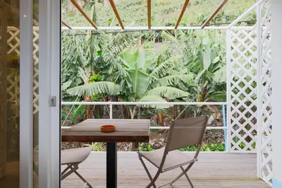 a dining room with a table and two chairs at Baldeia - Oceanfront Apartments in Ponta do Sol