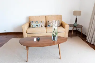 a living room with a couch and a coffee table at Fatima`s House in Funchal