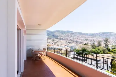 a balcony with a view of a city at Fatima`s House in Funchal