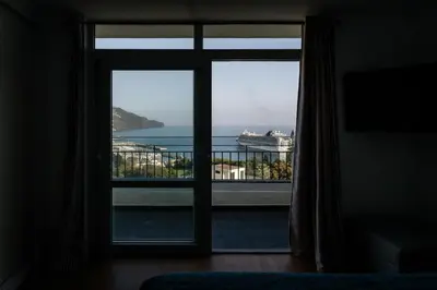 a room with a window with a view of the ocean at Fatima`s House in Funchal