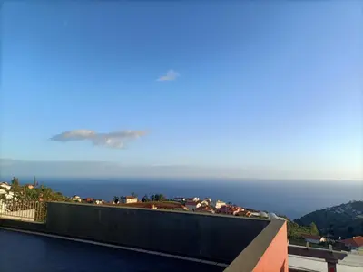 a view of the ocean from a building at Casa RuMa ao Sol in Ponta do Sol