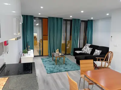 a living room with a couch and a table at Living Caboqueira in Funchal
