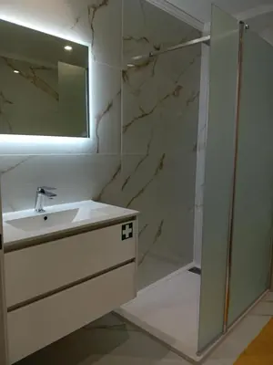 a bathroom with a sink and a shower at Living Caboqueira in Funchal