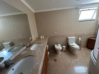 a bathroom with two sinks and two toilets at In Town View in Funchal