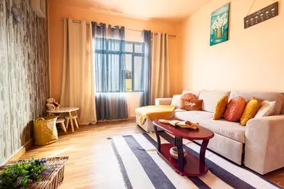 a living room with a couch and a table at Home Thomas in Lombada dos Marinheiros