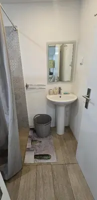 a bathroom with a sink and a mirror at Vila Loki in Funchal