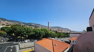 a view of a city with a street and buildings at Garden and Seaview Apartment - Free Parking in Funchal
