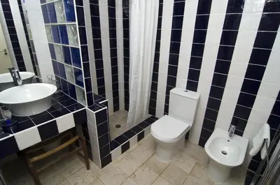 a bathroom with a toilet and a sink at LGS62 V3 casa e jardim a 100mts praia da Luz in Luz