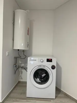 a washer and dryer in a small room at Neves GuestLoft by Madeira Holiday Rentals in Ribeira Brava