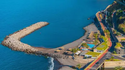 an aerial view of a beach next to the ocean at Neves GuestLoft by Madeira Holiday Rentals in Ribeira Brava