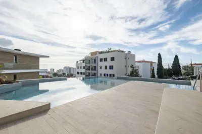 a swimming pool on the roof of a building at Inner City by Homie in Funchal