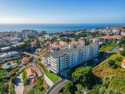 an aerial view of a city with the ocean at Inner City by Homie in Funchal