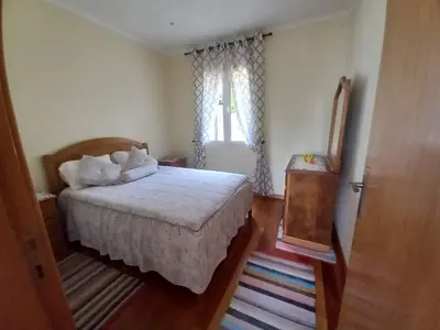 a bedroom with a bed and a window at Peaceful place in Porto Moniz in Salão