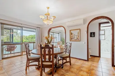 a dining room with a table and chairs at Central Lido Apartment by Homie in Funchal