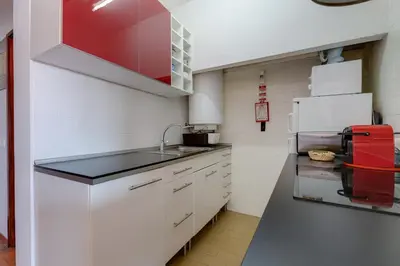 a small kitchen with a sink and a refrigerator at Casa da Irene - A047 in Luz