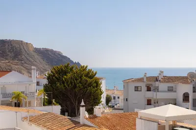 a view of a town with the ocean in the background at Casa da Irene - A047 in Luz