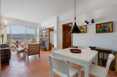 a dining room with a white table and chairs at Casa da Irene - A047 in Luz