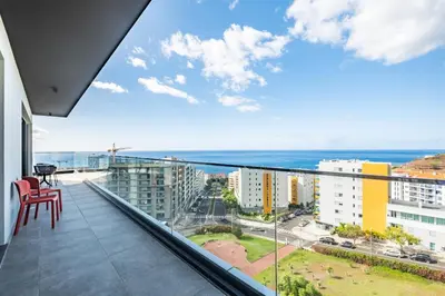a balcony with a view of the ocean at Tower Penthouse by Homie in Funchal