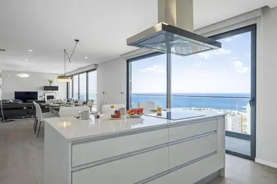 a kitchen with a view of the ocean at Tower Penthouse by Homie in Funchal