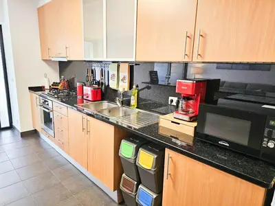 a kitchen with a sink and a microwave at Machico Oasis - Mountainview in Machico