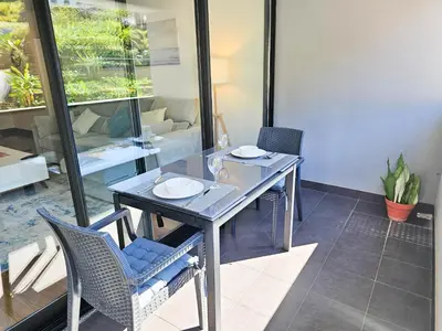 a dining room with a table and chairs at Machico Oasis - Mountainview in Machico