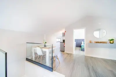 a white room with a table and a dining room at Pena View Apartment in Santa Cruz