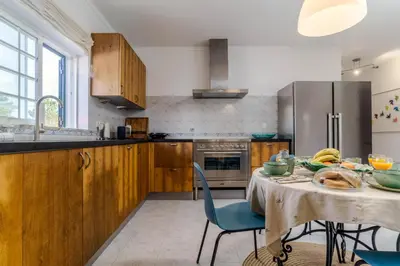 a kitchen with a table with food on it at Casa Sol a Sol - Villa with Swimming Pool by Lisbeyond in Aljezur