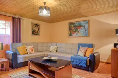 a living room with a couch and a table at Casa Primavera, a Home in Madeira in Ponta do Sol
