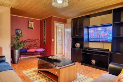 a living room with a couch and a tv at Casa Primavera, a Home in Madeira in Ponta do Sol