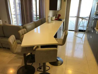 a living room with a table and a couch at Forum Ocean View Apartment in Funchal