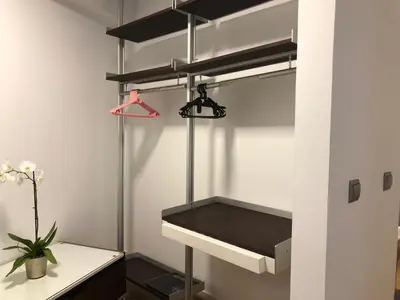 a walk in closet with a desk and shelves at Forum Ocean View Apartment in Funchal