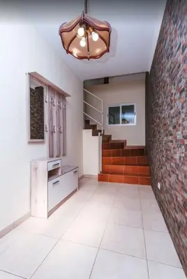 a room with a staircase and a brick wall at 2 Bedroom Apartment in Calheta in Arco da Calheta
