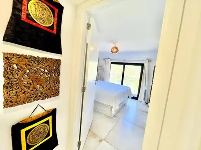 a bedroom with a bed in a room with a window at Mar a Vista by Your Madeira Rentals in Ponta do Sol