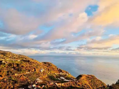 a view of the ocean from a hill with the sky at Mar a Vista by Your Madeira Rentals in Ponta do Sol
