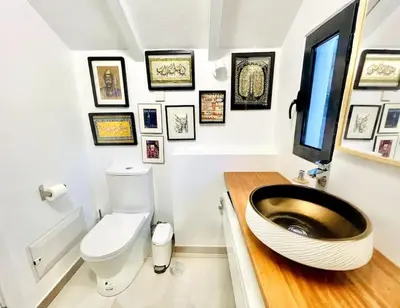 a bathroom with a sink and a toilet in it at Mar a Vista by Your Madeira Rentals in Ponta do Sol