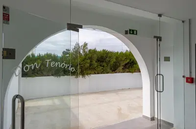 an archway in a building with a window with the words town tempo at 3 Minutes TO THE BEACH, 2 BEDROOM AMAZING APT WITH BALCONY, BBQ GRILL AND POOL in Sagres