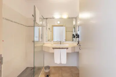 a bathroom with a sink and a mirror at Quinta Alegre in Calheta