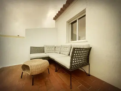 a mirror on the wall of a room with a woman dancing at Algarve Surf House in Raposeira