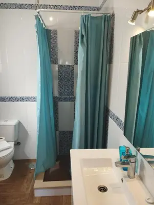 a bathroom with a sink and a shower at Casa Sarguito in Sagres