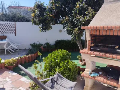 a backyard with a garden with a swimming pool at Casa Sarguito in Sagres