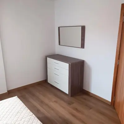 a room with a dresser and a mirror on a wall at Casa Bela Vista Studio 2 in Ribeira Brava