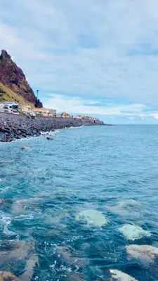 a body of water next to a rocky beach at Casa Marcelino Refugio Frente Mar in Paul do Mar